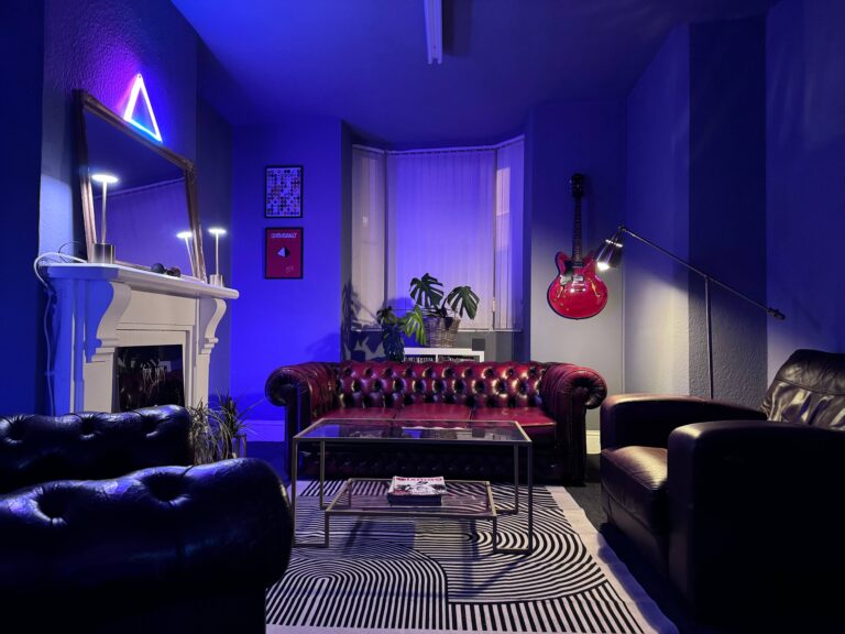 Chesterfield sofa and fireplace in the Drop Studios lounge