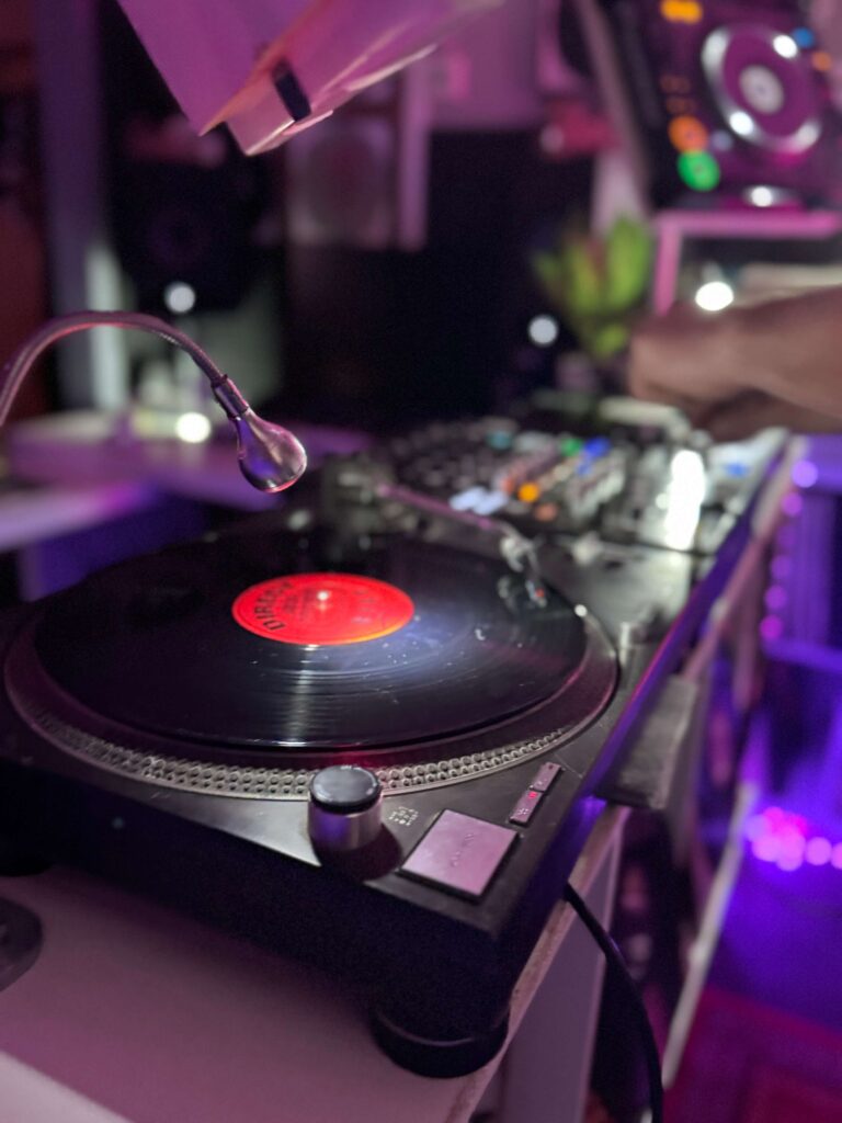 Turntable with vinyl record in the Drop Studios DJ booth