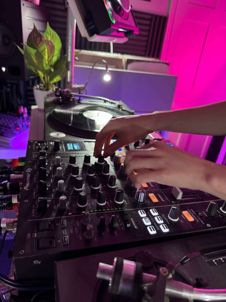DJ mixing on a controller at Drop Studios, Northamptonshire