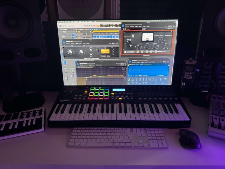 Music production setup with MIDI keyboard and studio monitors at Drop Studios